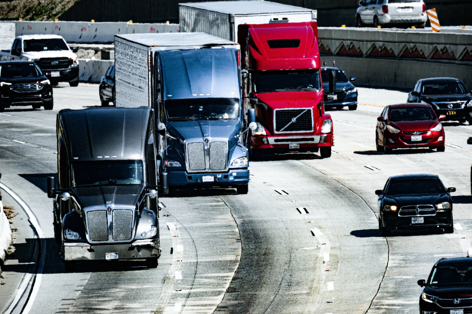 trucks and cars on a highway