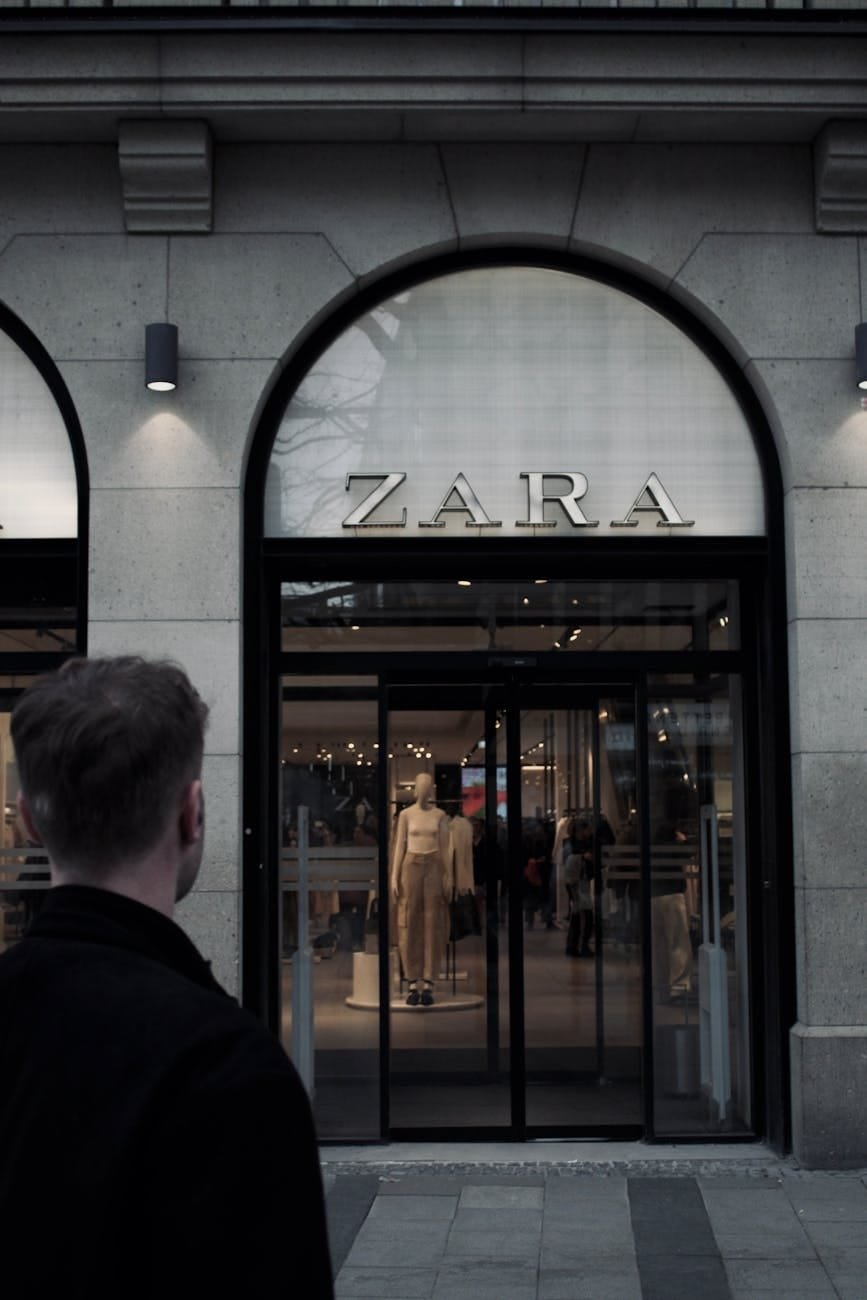 zara storefront with shopper in city center