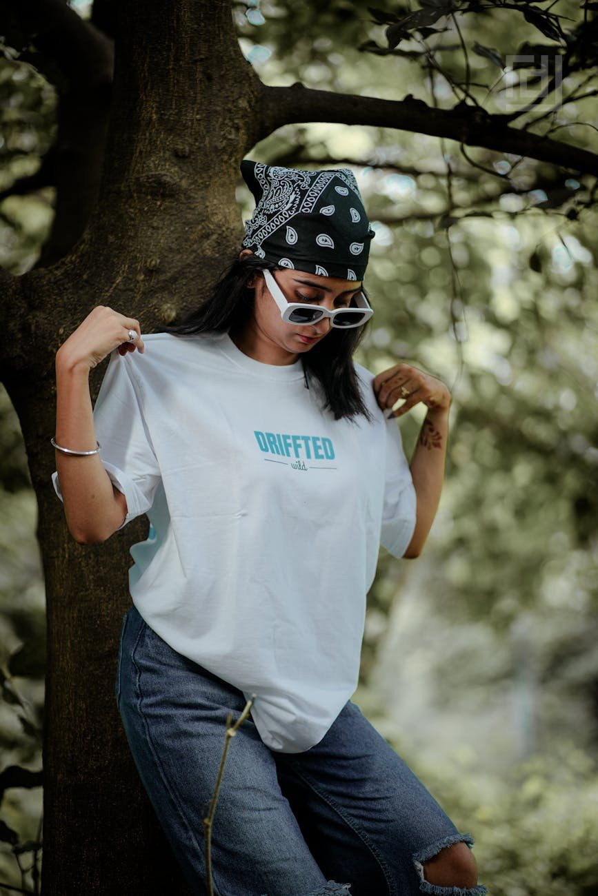 stylish woman posing outdoors with bandana