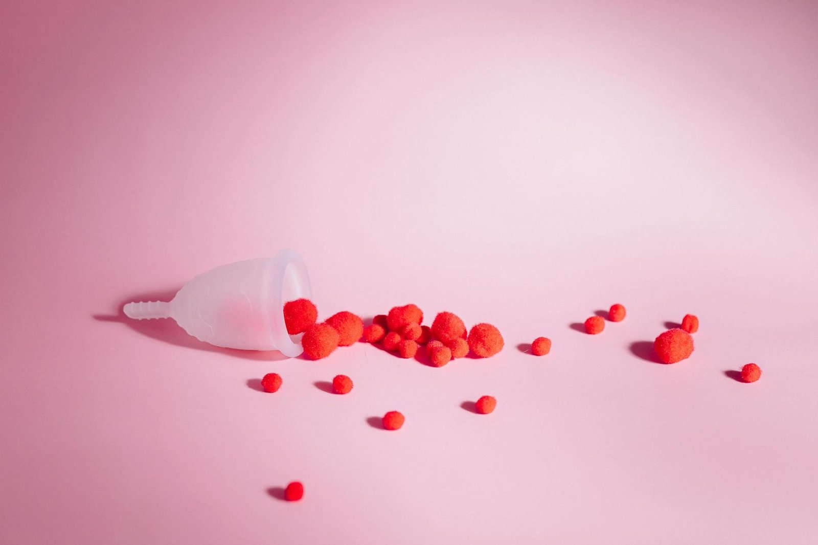 red round fruits on white surface