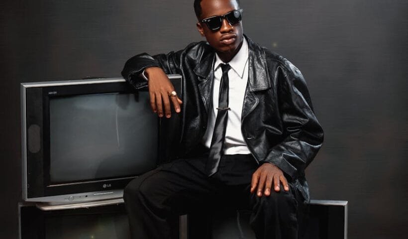 stylish individual in leather with retro tvs