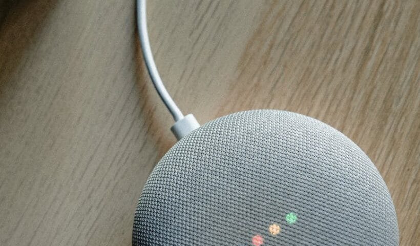 portable speaker on brown wooden table