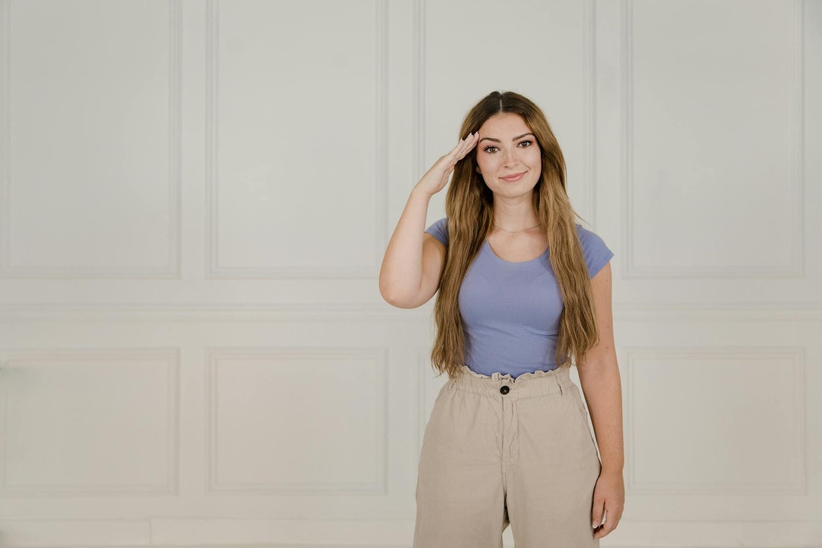 woman standing and using sign language