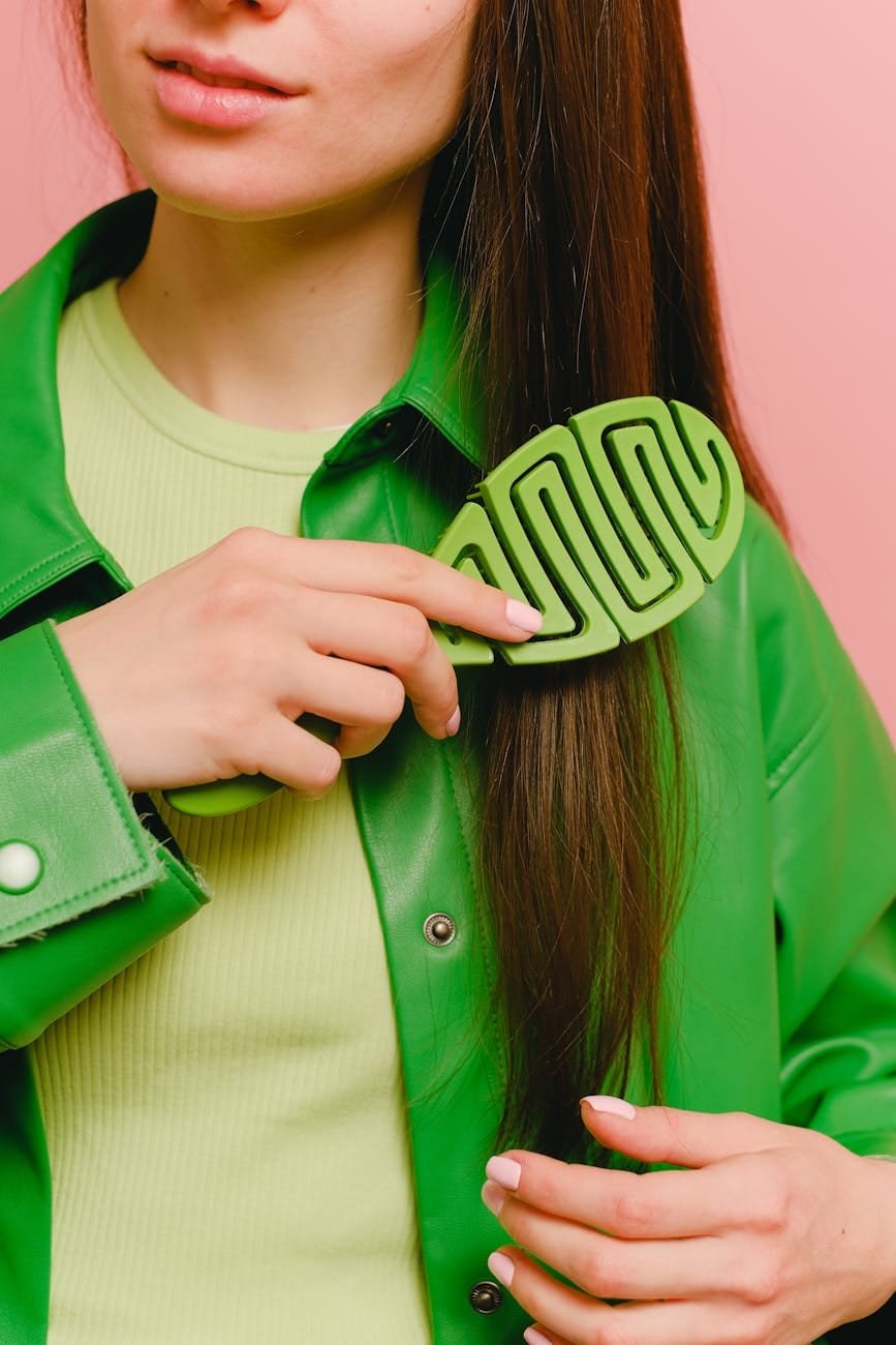 a woman brushing her hair
